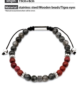 Detailed macro view of men's tiger eye stone bracelet with adjustable steel clasp