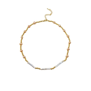 Baroque pearl necklace with gold beads and pink pearls on a clean white background
