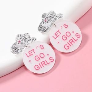Cowboy hat acrylic earrings with Let’s Go Girls pendant on a pink background