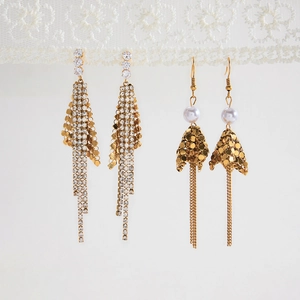 Detail of vintage 18K gold stainless steel fringe earrings with zircon and white pearls