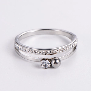 Detailed view of silver double-layer ring featuring six-prong cubic zirconia and metal bead