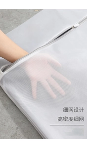 Close-up of fine mesh laundry bag texture with hand showing high density polyester weave
