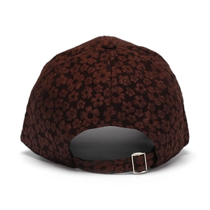 Detail of floral baseball cap back view with adjustable strap and metal buckle