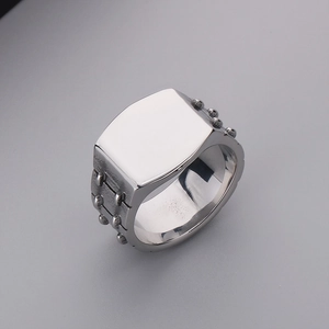Detail view of vintage silver square signet ring with side stud texture for men