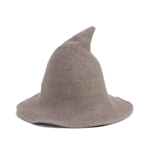 Brown knitted pointed witch hat with wide wavy brim for Halloween and autumn fashion