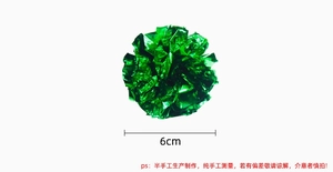 Detailed view of 6cm green crinkle paper ball toy for cats with metallic texture