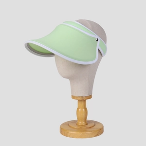Pale green tech sun visor hat with white trim and open top for summer outdoors