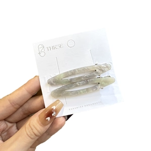 Barrettes à cheveux minimalistes en acétate gris marbré avec design ovale creux élégant