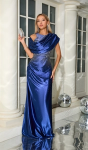Detail of royal blue evening gown featuring sparkling rhinestones on premium satin fabric