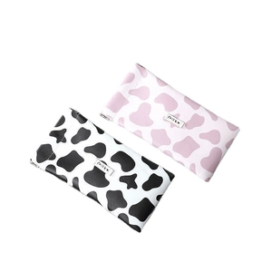 Cute cow print leather sunglasses pouch in pink and black with snap closure