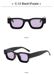 Macro shot of square punk sunglasses featuring thick black frames and purple lenses