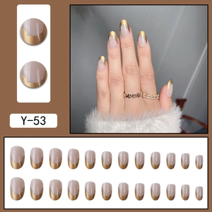 Short round nude press-on nails with irregular gold French tips 24-piece full set