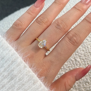 Elegant pear cut cubic zirconia S925 sterling silver ring in gold finish on hand