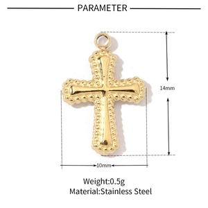 Macro detail of gold stainless steel cross pendant with 14mm by 10mm size dimensions