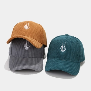 Corduroy baseball caps with skeleton hand embroidery in brown, gray, and green colors