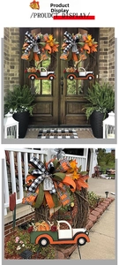 Detail of autumn wreath with maple leaves, pumpkin truck, and Happy Harvest tag