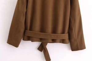 Detailed back view of brown wool short coat featuring a stylish waist tie and hemline