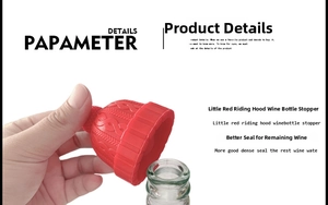Close-up of a red knitted hat shaped silicone wine stopper being placed on a glass bottle