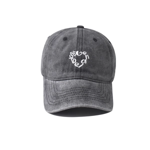 Macro shot of embroidered heart pattern and stitching on washed cotton baseball cap