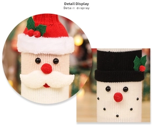 Detail of knitted Santa and Snowman wine bottle covers with rich wool textures