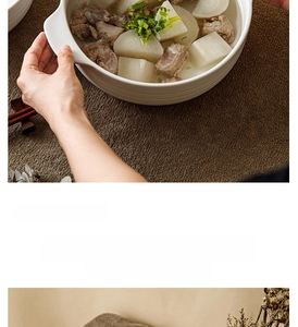 Macro detail of white ceramic soup bowl with horizontal ribbed texture and side handles