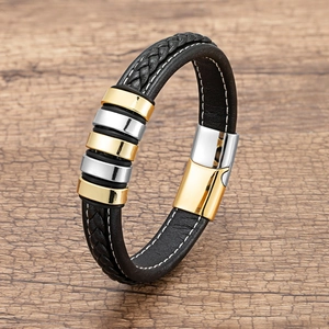 Men's braided leather bracelet with two-tone gold and silver metal rings and magnetic clasp