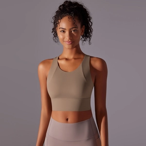 Detail of cross-back yoga bra with thick straps and moisture-wicking fabric