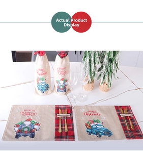 Christmas dining set with Gnome place mats and wine bottle covers on marble background