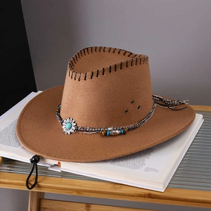 Detail of vintage brown cowboy hat with sunflower bead decor and adjustable chin strap