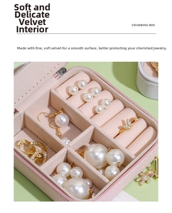 Macro view of pink velvet lining in portable jewelry box with rings and earrings