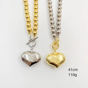 Detail view of 41cm heart pendant toggle clasp necklaces in gold and silver finish
