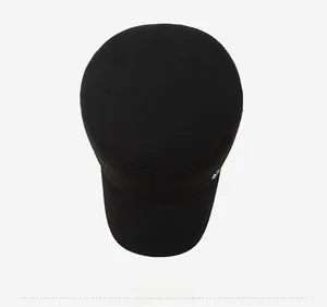 Top down macro view of thick black wool blend cadet cap with small metal detail
