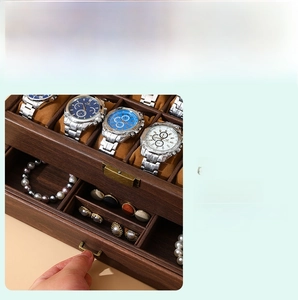 Detail of double-layer vintage wood grain watch box with drawer and antique metal handle