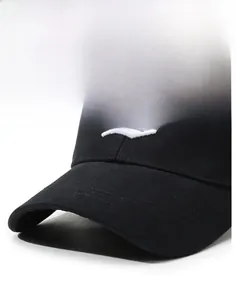 Close-up of a black baseball cap with premium gothic white D embroidery and stiff brim