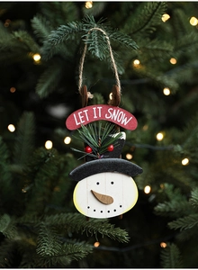 Close-up of wooden snowman ornament with pine needles and Let It Snow text