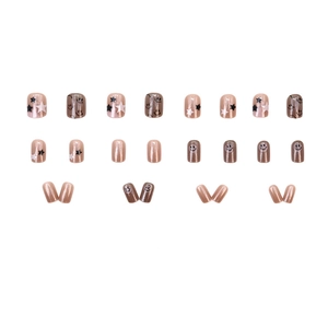 Pink and brown shimmering press-on nails featuring star and smiley face designs
