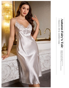 Detail of silk satin nightgown showing delicate floral lace trim and V-neckline texture