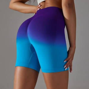 Close-up of seamless purple to blue gradient yoga shorts with high waist gym fabric detail