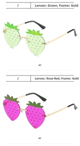 Detail of strawberry-shaped sunglasses with gold frames and red or green lenses