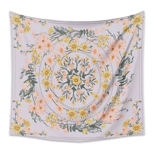 Detail of yellow and orange mandala floral pattern on soft purple bohemian tapestry