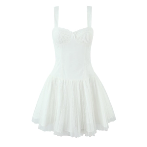 White mesh strap dress with bow bodice and layered tulle skirt in a minimalist style