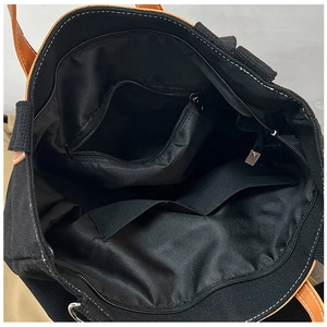 Top view of spacious canvas tote bag interior with zipper pocket and lining detail