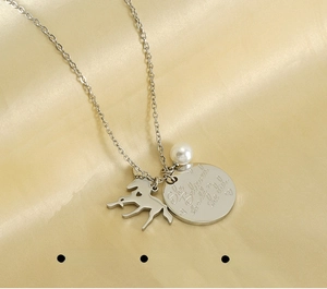 Detail of unicorn pendant and engraved she believed she could tag on silk background