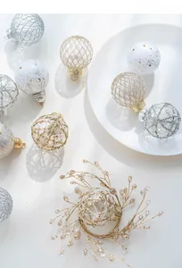 Detailed view of 6cm gold and silver Christmas ornaments with glitter and star patterns