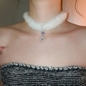 Detail of white plush choker necklace with purple flower pendant and crystal drop