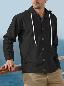 Detail of black hooded linen shirt for men featuring button placket and white drawstring cord
