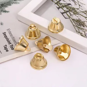 Set of six shiny gold metal bells for Christmas DIY crafts and holiday decorations
