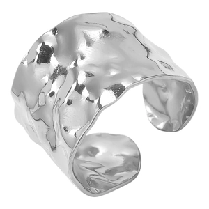 Macro detail of silver 304 stainless steel ring with hammered texture and open band design