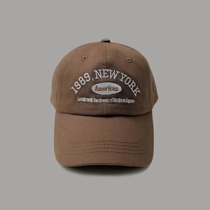 Brown retro baseball cap with 1989 New York embroidery and white letter stitching