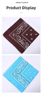 Close-up of blue and brown paisley polyester bandanas with detailed edge stitching